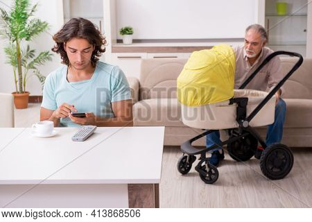 Retired grandfather looking after newborn at home