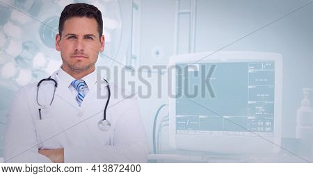 Portrait of caucasian male doctor with arms crossed standing at hospital. healthcare and professionalism concept standing
