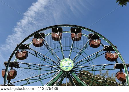 SANTA ANA, CALIFORNIA - 8 OCT 2020: Closeup of the 50 Monkeys Ferris Wheel at the Santa Ana Zoo. 