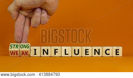 Weak Or Strong Influence Symbol. Businessman Turns Cubes And Changes Words 'weak Influence' To 'stro