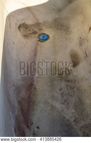 Street Lighting. The Old Cast-iron Tub Is All Ruined And Covered In Rust. Enamel Peeled Off