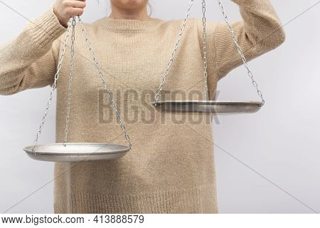 Man Is Holding The Scales. Equilibrium, Justice Concept