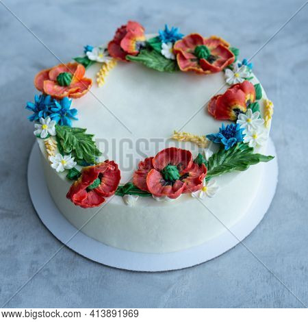 Cake With Buttercream Frosting Decorated With Buttercream Flowers, Poppies, Chamomile, Cornflowers, 