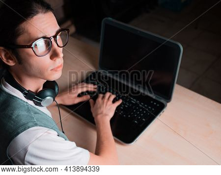 Write Code And Learn Programming Languages. A Student Or Specialist Is Doing A Project.