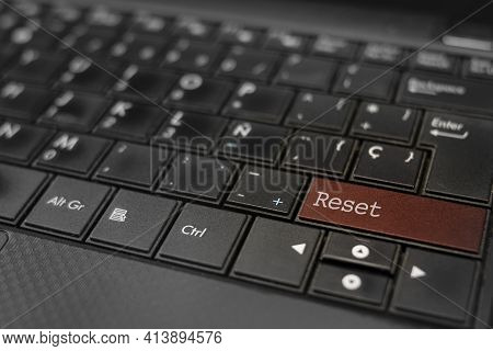 Reset Concept. Reset Key Embedded In A Computer Keyboard