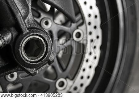 Front Wheel Axle Of A Sport Motorcycle Ready To Run In Gray Tones