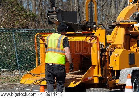 Wood Chipper Machine Releasing The Shredded Woods Worker