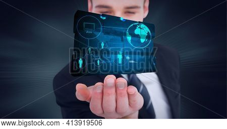 Composition of network of digital icons with globe on digital screen over hand of businessman. global technology and digital interface concept digitally generated image.