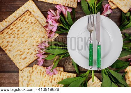 Dinner Table Setting With Flowers For Passover. Jewish Holiday Pesach.