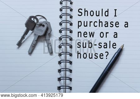 Text Written On Notebook With House Keys And Pen - Should I Purchase A New Or Sub-sale House