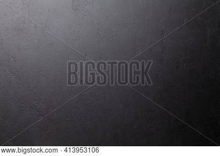 Dark grey stone background. Black slate texture. Wall or floor natural surface