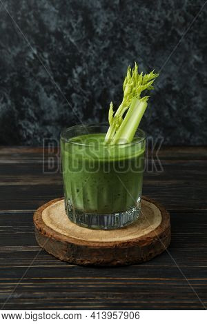 Glass Of Green Smoothie With сelery On Board On Wooden Table