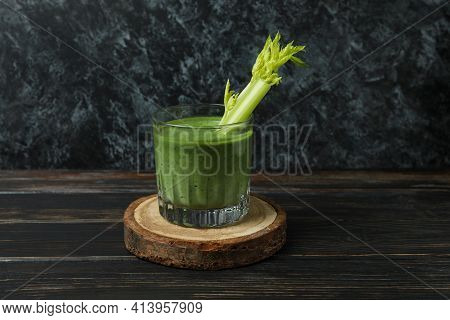 Glass Of Green Smoothie With сelery On Board On Wooden Table