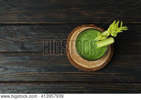 Glass Of Green Smoothie With сelery On Board On Wooden Table