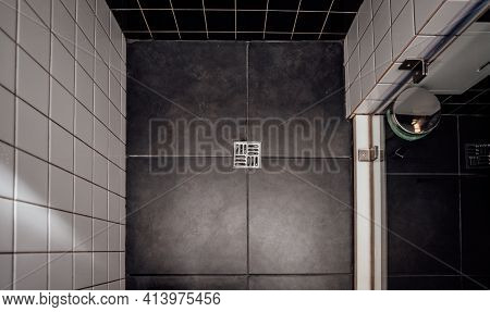 Floor Drain, Running Water In Shower, White And Black Tiles