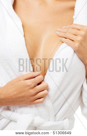 Close up on woman breast after bath. She is wearing bathrobe.