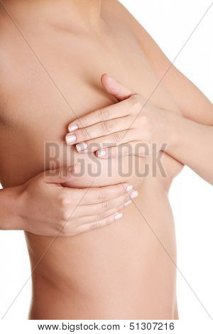 Woman examining breast mastopathy or cancer. Isolated on white
