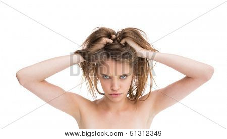 Bare natural woman looking angry at camera