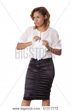 Angry Woman Rips Up Papers With A Scowl On Her Face.