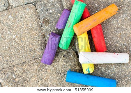 Colorful Chalks On The Paver Streets