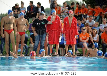 KAPOSVAR, HUNGARY - SEPTEMBER 15: Honved players listening to trainer iat a Hungarian championship water-polo game between Kaposvar (white) and Honved (blue) on September 15, 2013 in Kaposvar, Hungary