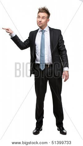 Full-length portrait of business man setting against something who wears suit with blue tie, isolated on white