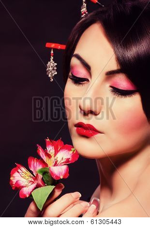 Beautiful young woman in red Asian costume