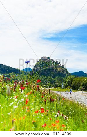 Hochosterwitz Castle In Austria Among Poppy Flowers