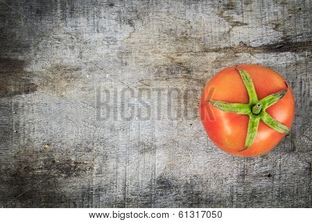 Overview red tomato on wood background