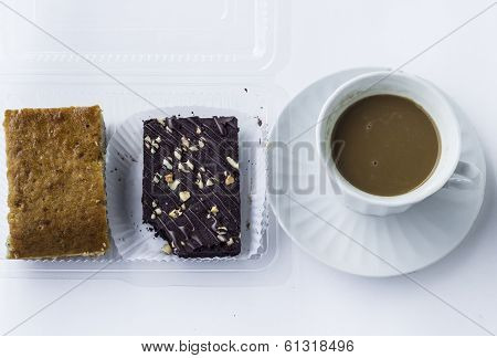 cup of coffee and bananas cake with chocolate brownies