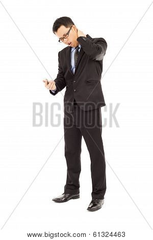 Businessman Having Neck Pain With Using Cell Phone