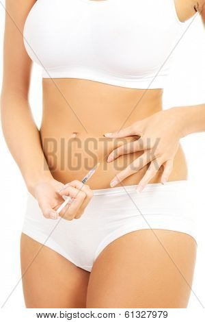 Diabetes woman patient make an abdomen subcutaneous syringe insulin injection with needle 