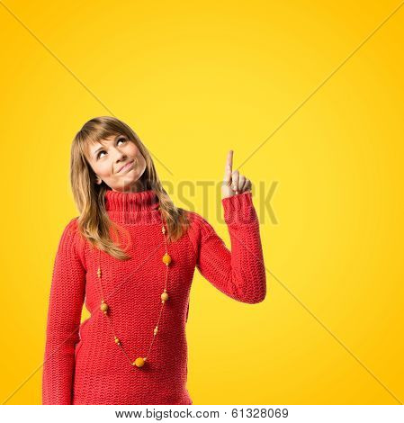 Young Girl Thinking Over Yellow Background