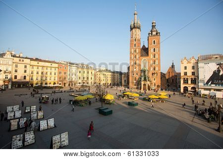 KRAKOW, POLAND - FEB 26, 2014: View of the Main Square. It dates to the 13th century, and at roughly 40,000 m it is the largest medieval town square in Europe.