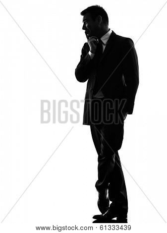 one caucasian effeminate snobbish business man in silhouette  on white background