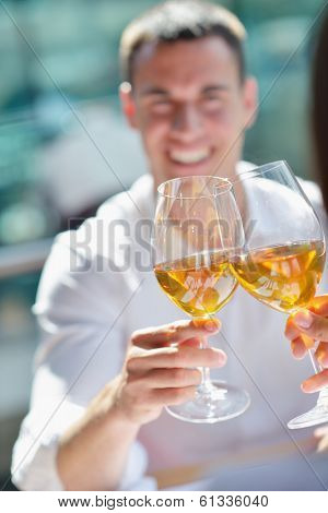 happy young couple having lanch at beautiful restaurant on the beach