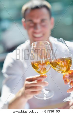 happy young couple having lanch at beautiful restaurant on the beach