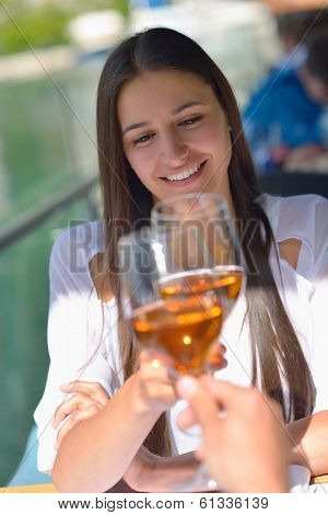 happy young couple having lanch at beautiful restaurant on the beach