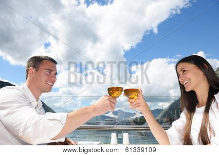 happy young couple having lanch at beautiful restaurant on the beach