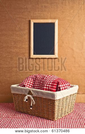 Bread In Wicker Basket Covered With Kicthen Rag