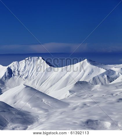 View On Off-piste Snowy Slope At Nice Sunny Day