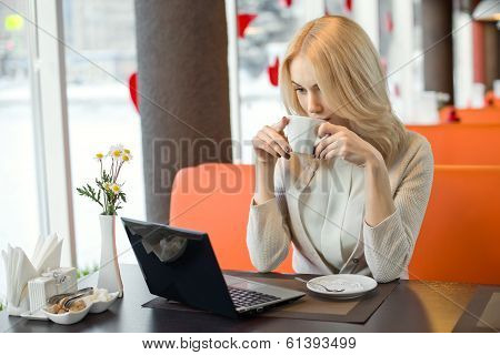 Young Woman In Cafe