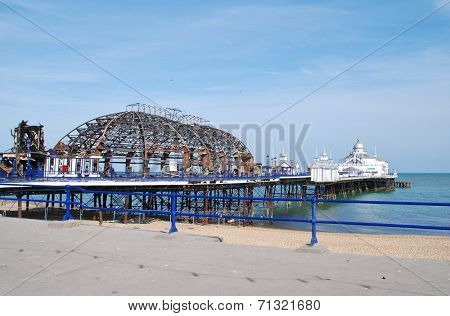 EASTBOURNE, ENGLAND - JULY 31, 2014: The Victorian pier which was badly damaged by fire on July 30, 2014. Designed by Eugenius Birch, the landmark was first opened in 1870.