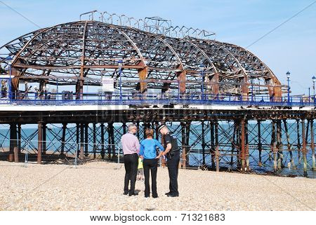 EASTBOURNE, ENGLAND - JULY 31, 2014: The Victorian pier which was badly damaged by fire on July 30, 2014. Designed by Eugenius Birch, the landmark was first opened in 1870.
