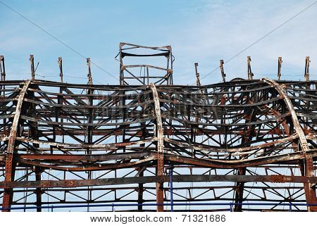 EASTBOURNE, ENGLAND - JULY 31, 2014: The Victorian pier which was badly damaged by fire on July 30, 2014. Designed by Eugenius Birch, the landmark was first opened in 1870.