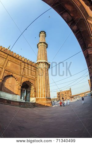 Group Of Worshipers Rest On Courtyard Of Jama Masjid Mosque In Delhi