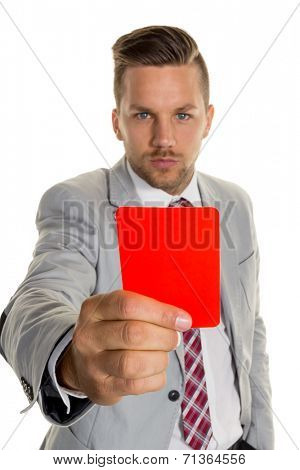 a manager holds a red card in hand. symbol photo for resignation or dismissal