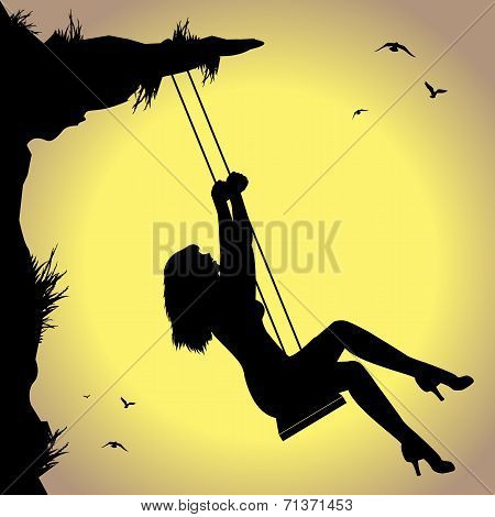 silhouette of woman on swing