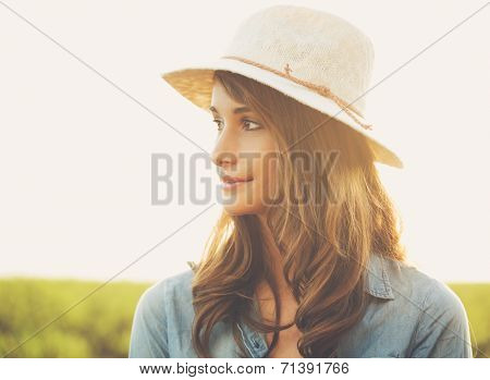 Warm Sunny Portrait of Beautiful Young Woman in the Countryside