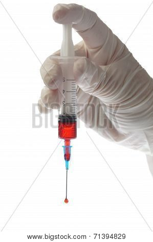 Hand With Syringe Isolated On White